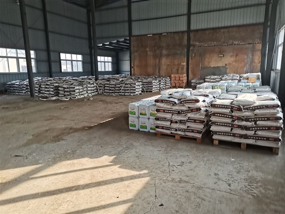 Warehouse with bulk-stacked and palletised bags of material ready for shipment
